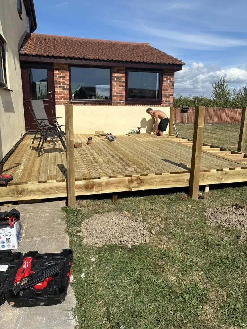 Laying the deck boards on the raised frame