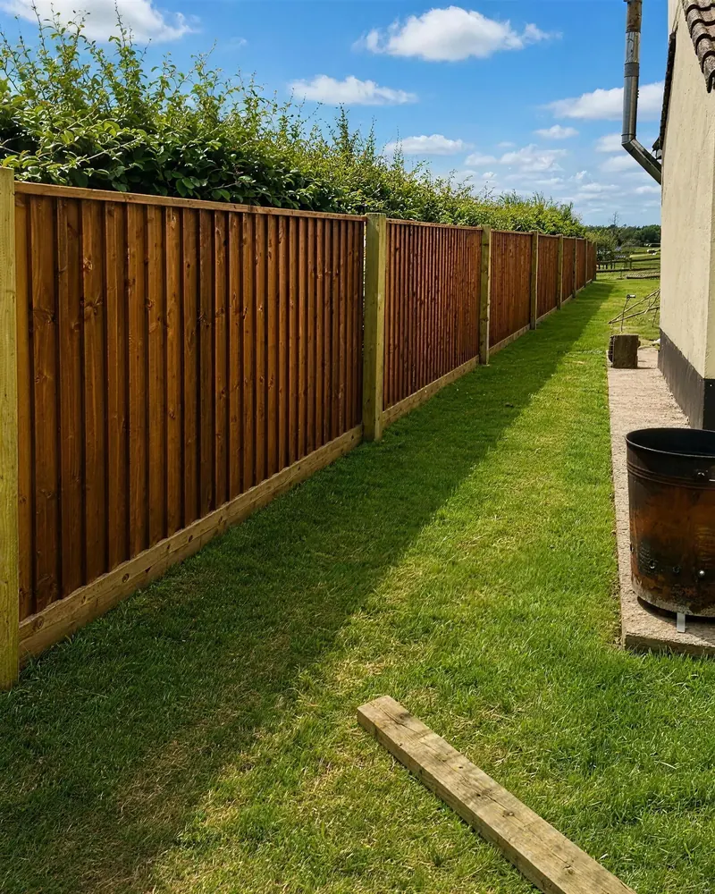 After: a new closeboard fence on the same line