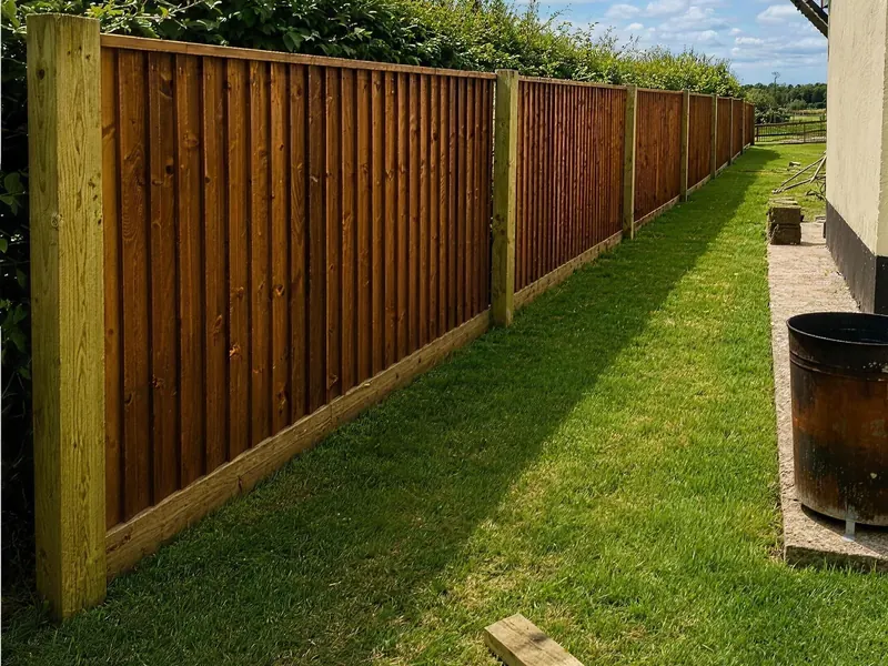 After: a closeboard fence on the same line with new posts and gravel boards