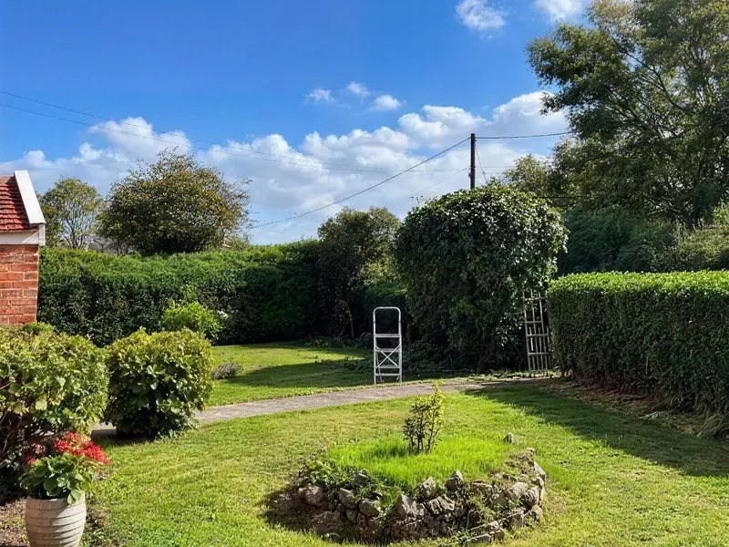 After: the lawn cut, the edges done and the bed tidied